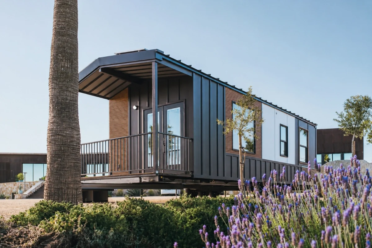 Clever Tiny Homes Clever 1 one-bedroom tiny home exterior with black metal and wood cladding
