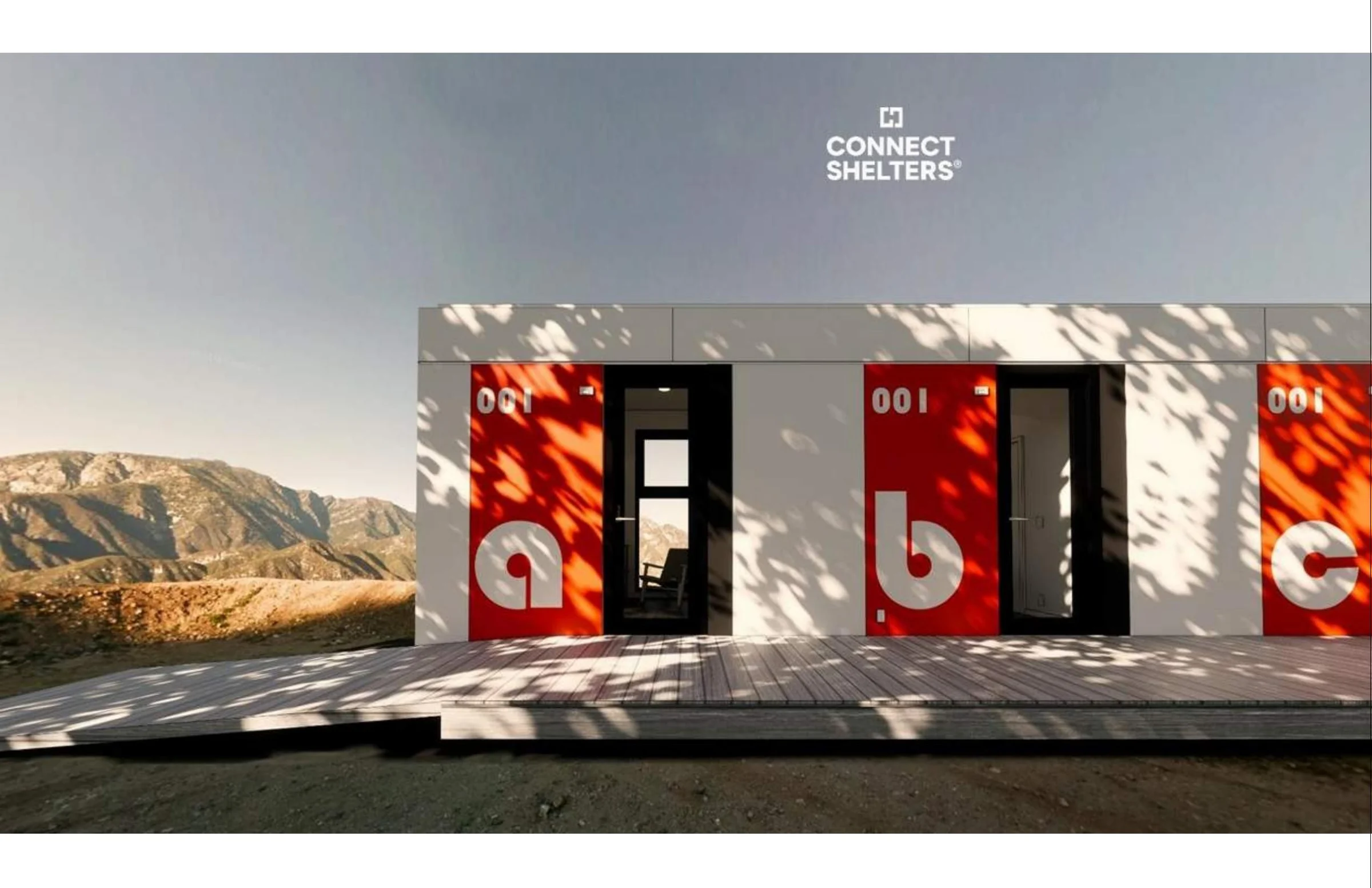 Connect Shelters modular units with red entry doors in a mountain setting