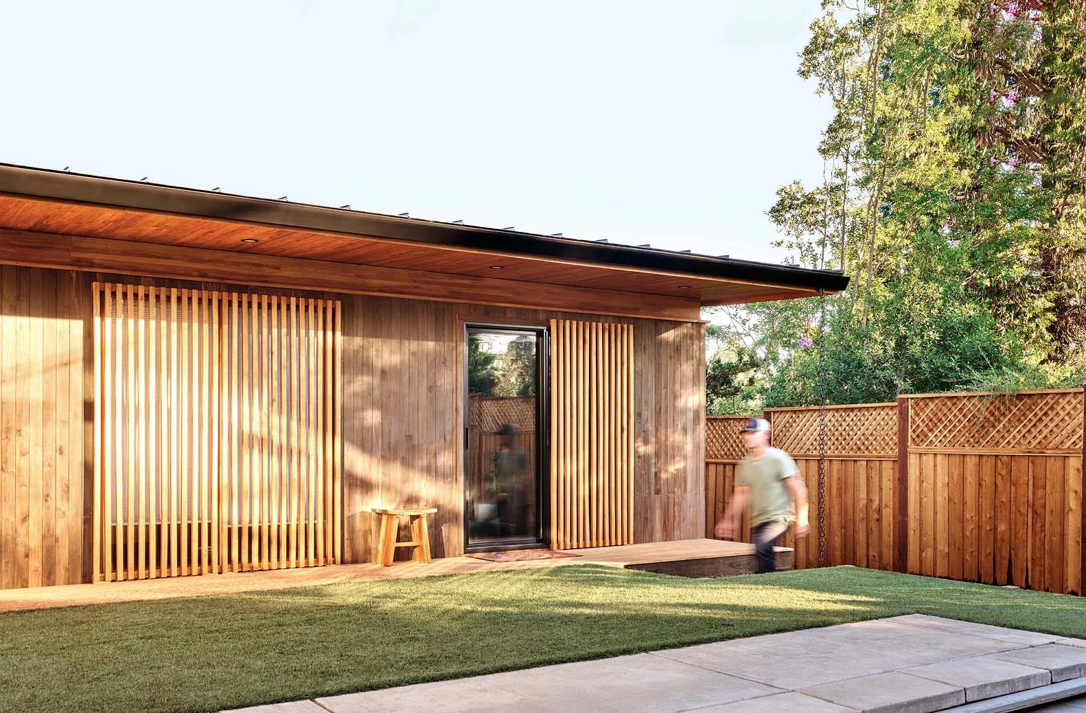 Exterior of Masaya Homes M One Bedroom with teak cladding and a compact backyard deck