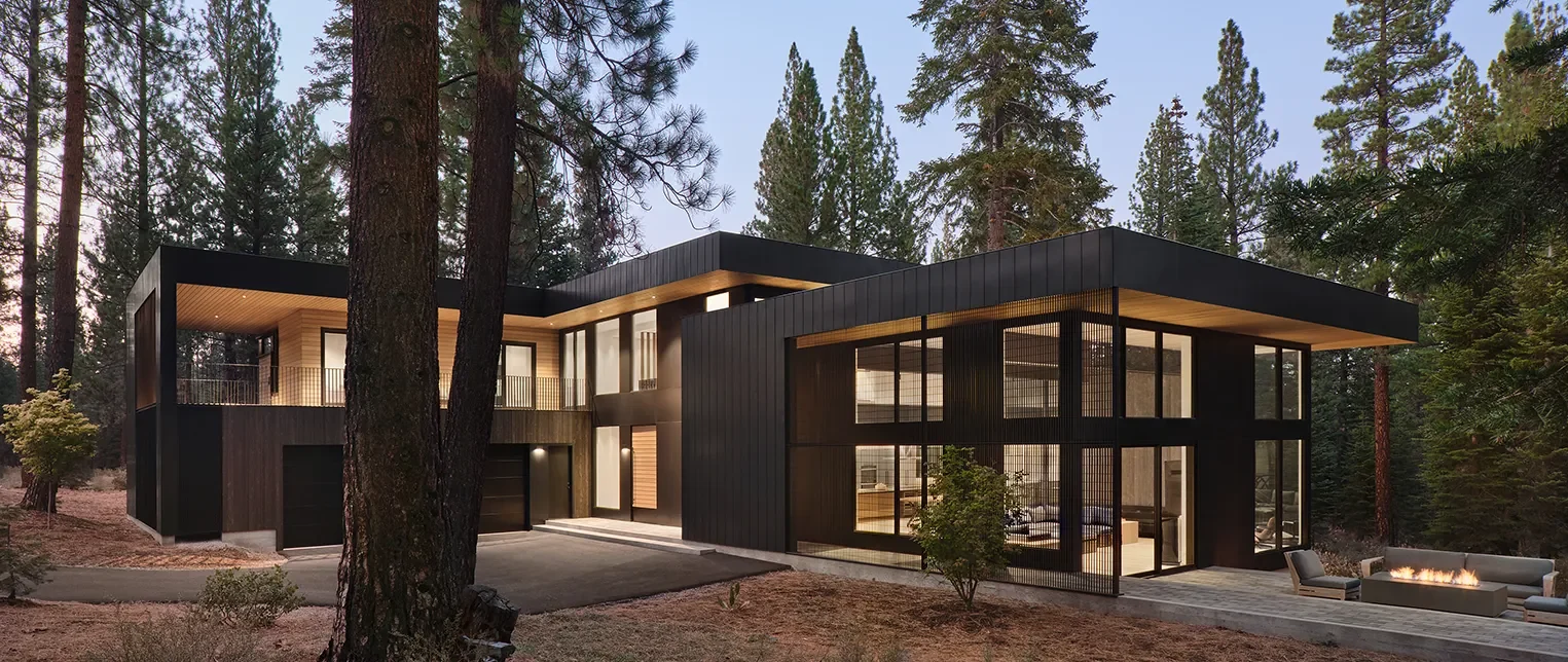 Twilight exterior view of a custom modular home in Method Homes’ residential portfolio