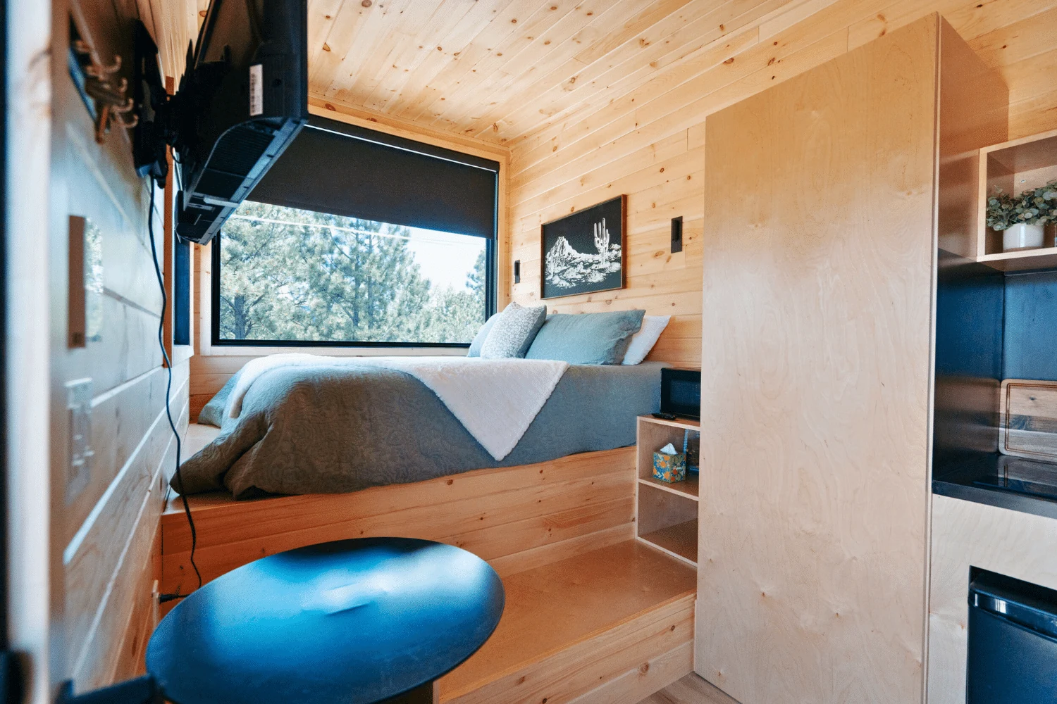 Bedroom inside the Nook Studio park model.