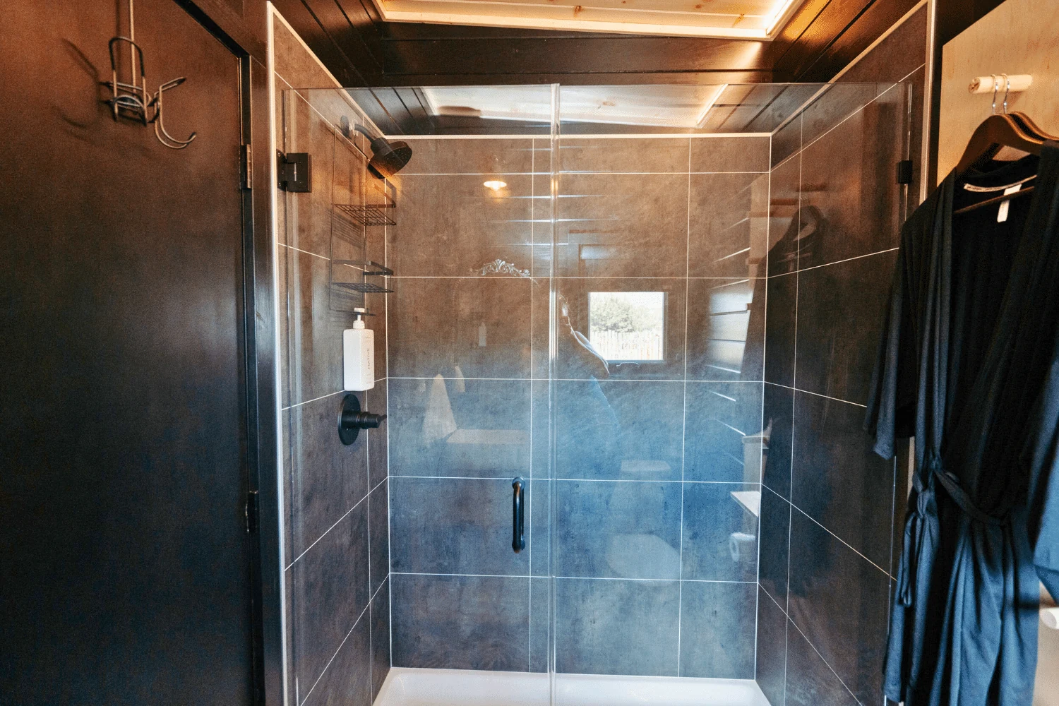 Tiled shower inside the Nook Studio park model.