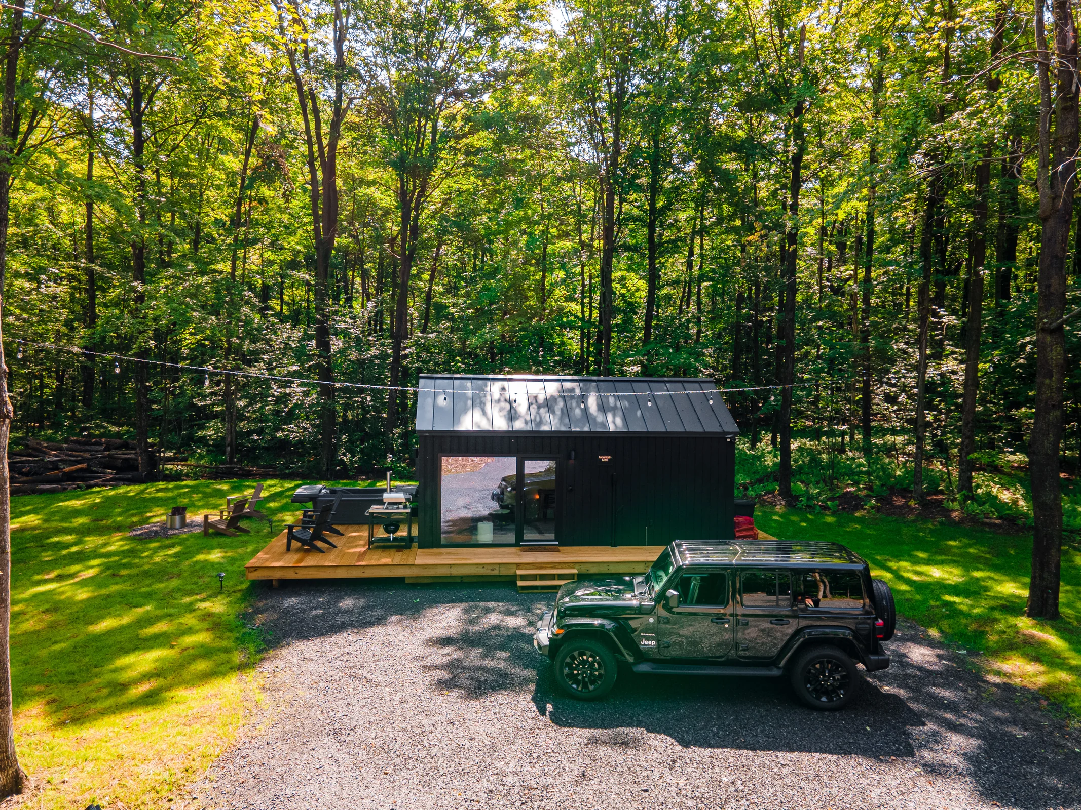 A MyCabin Mountain Milla prefab cabin in a wooded landscape in Jefferson, New York