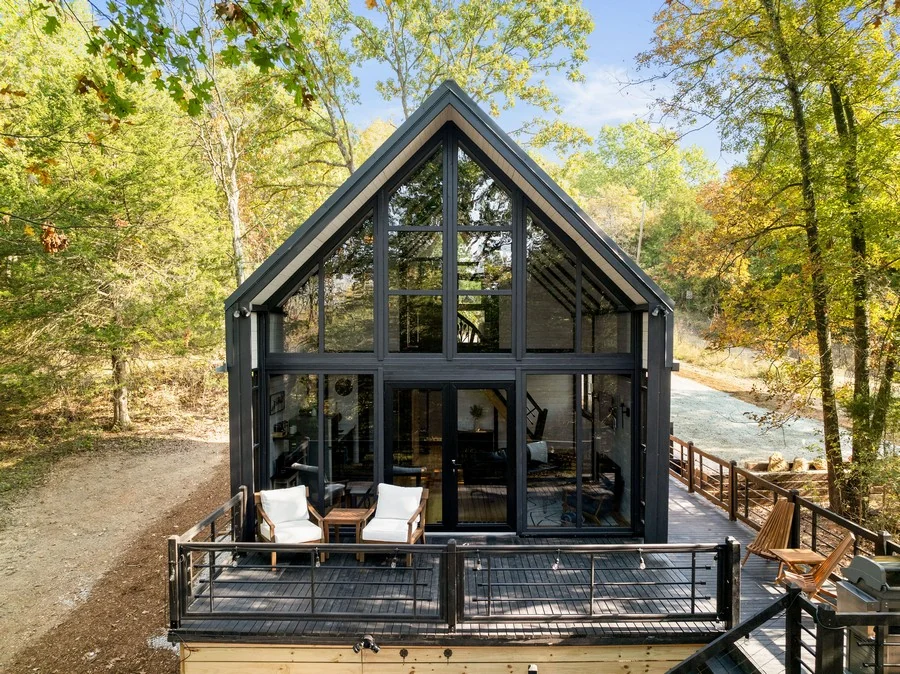 Completed SolidCabin Aries 96 cabin exterior with glazed A-frame front in Arkansas