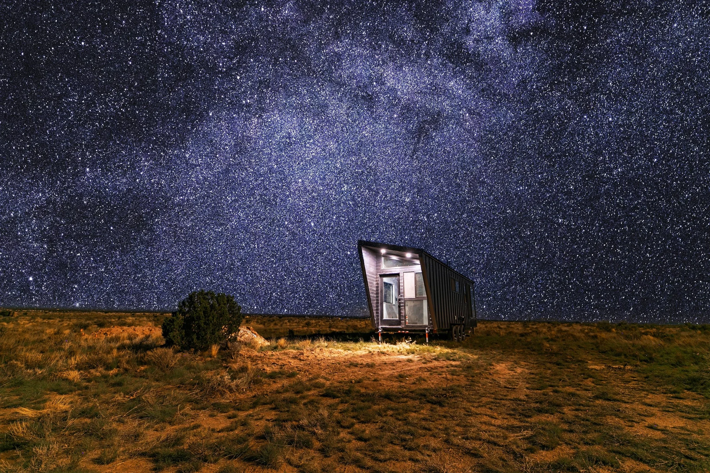 Stargazing Homes Stargazer tiny home beneath a night sky in a desert setting