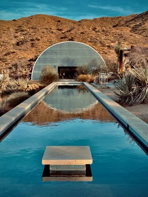 Circular reflection of the turquoise arch at High Desert Protocol.
